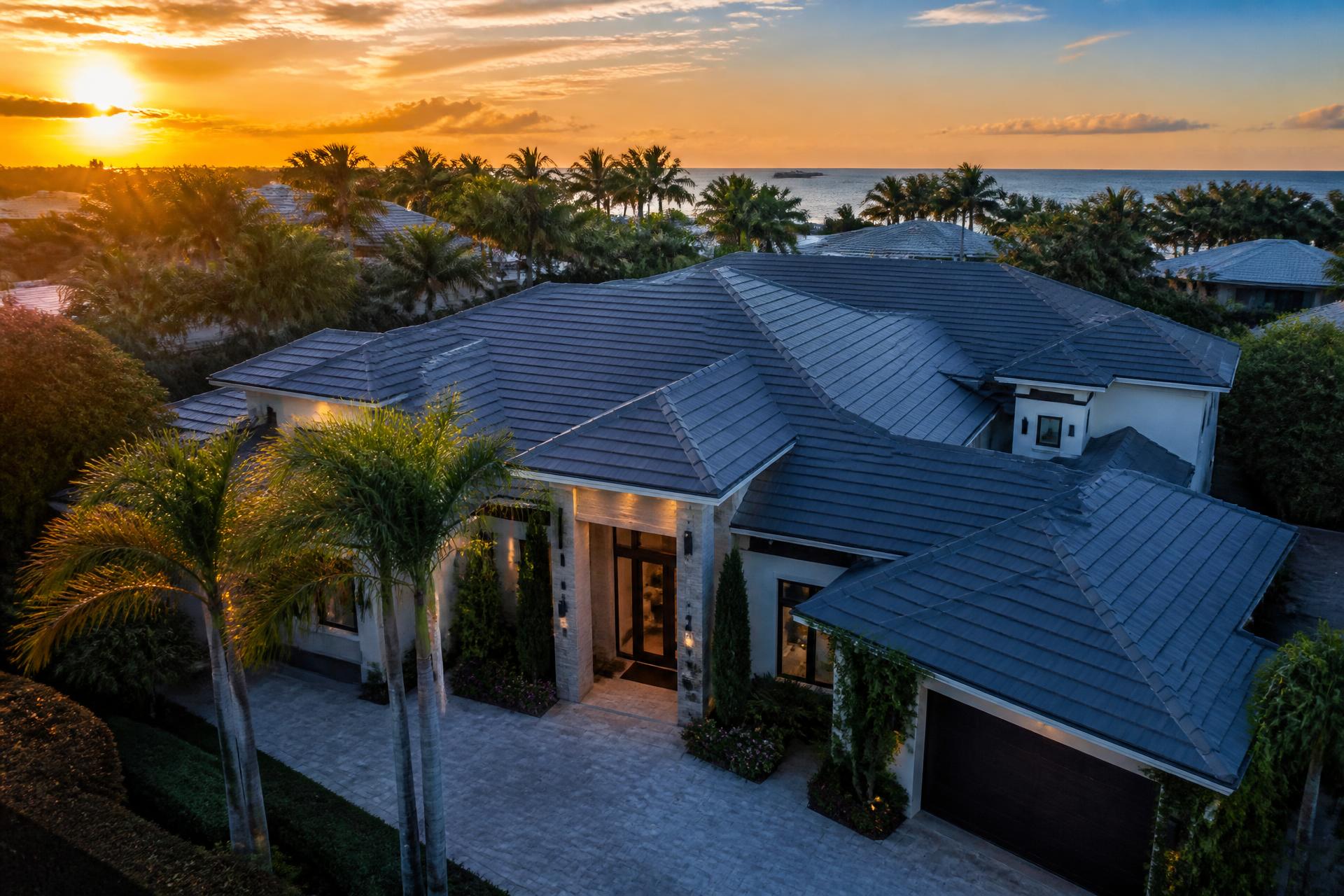 Premium tile roof on a South Florida luxury home at golden hour